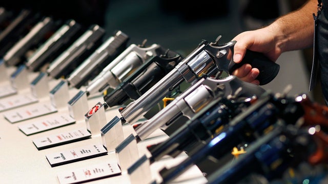 In this Jan. 19, 2016, file photo, handguns are displayed at the Smith & Wesson booth at the Shooting, Hunting and Outdoor Trade Show in Las Vegas. 