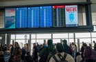 Passengers At Austin-Bergstrom International Airport In Austin, Texas. 