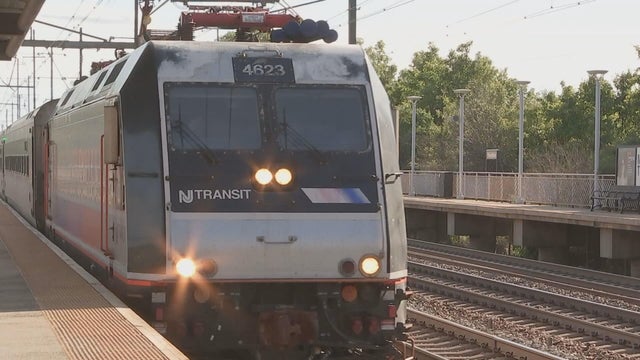 A New Jersey Transit train leaving a station 